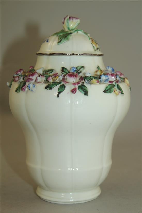 A Mennecy porcelain floral encrusted ogee-shaped vase and cover, c.1760, 17.5cm